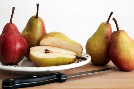 Pears on plate, one cut in half