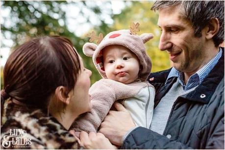 Cute autumn family engagement shoot baby in reindeer costume 