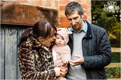 Family engagement shoot baby in reindeer costume