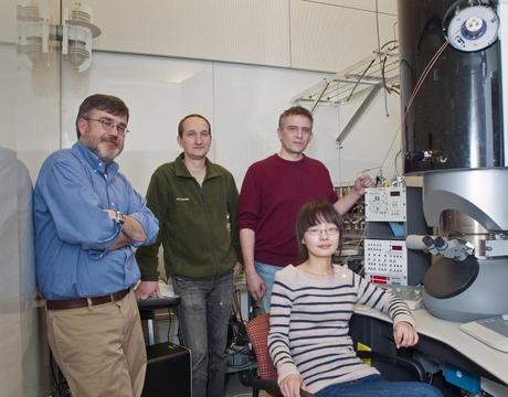 Eric Stach and Dmitri Zakharov of the CFN with Anatoly Frenkel of Yeshiva University and his postdoc, Yuanyuan Li, sitting at the Titan 80/300 Environmental Transmission Electron Microscope at the Center for Functional Nanomaterials.