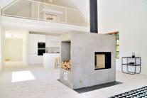 Lofty Swedish house with a concrete fireplace by Sandell Sandberg