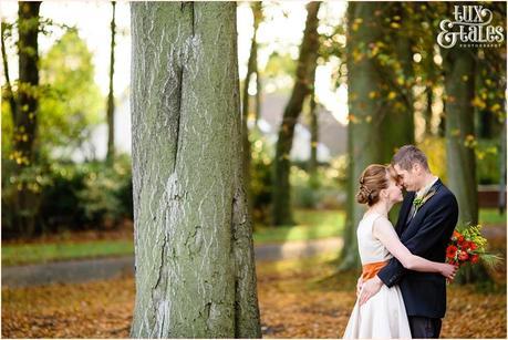 Bride & groom in the autumn leaves in Swanland