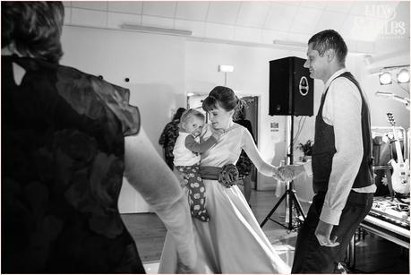 Bride holds son during dance at Hull wedding