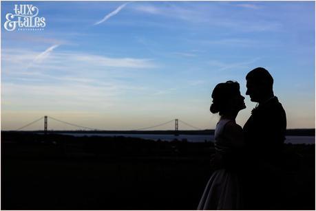 Shillouette of bride and groom in front of humber bridge wedding photography