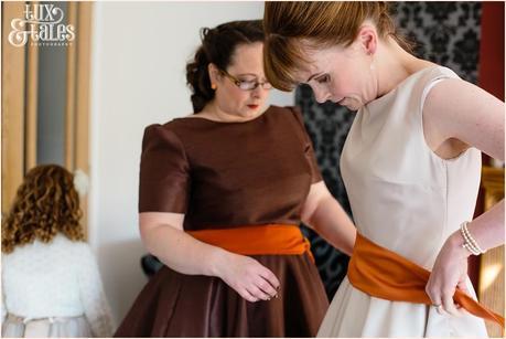 Bride in Autumn themed wedding dress in champaign and orange