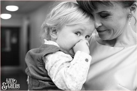 Bride holds son at town hall wedding in yorkshire Autumn themed