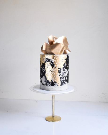 black and gold cakes with white one layer