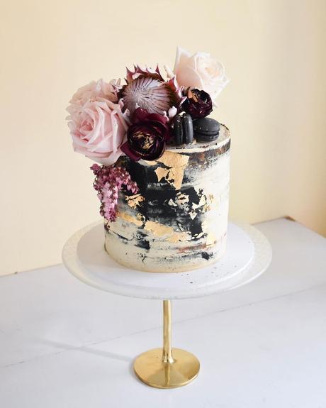 black and gold cakes with rose decor