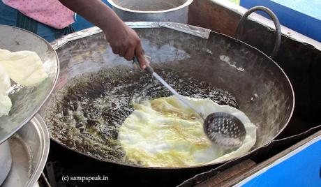frying deep in oil - the tasty, crunchy Appalam !!