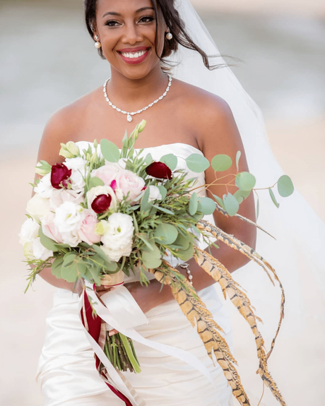 beach-wedding-bride with white green and burgundy bouquet