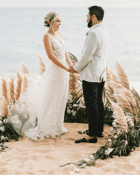 beach wedding bride and groom by the sea