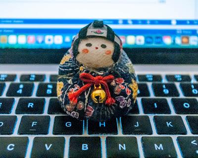 A cute little object – a pincushion perhaps? – posed in several settings