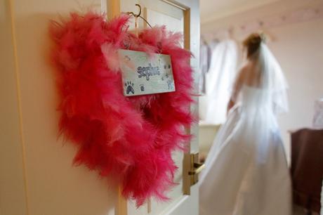 the brides name in feathers on her bedroom door