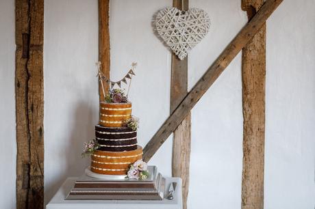 a naked wedding cake at a maidens barn wedding