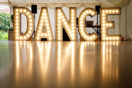huge dance sign made by the groom
