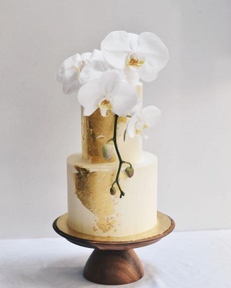 tropical wedding cakes gold with white flowers