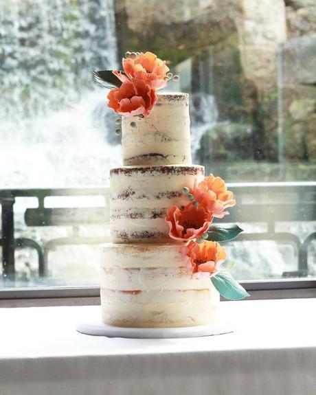 tropical wedding cakes three layers with orange flowers