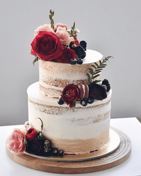 naked wedding cakes 2 tier with red flowers