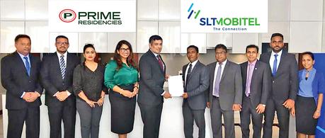 Imantha Wijekoon, Chief Regional Business Officer, SLT and Manjula Weerakkody, Managing Director, Prime Lands Residencies PLC, exchange the agreement.