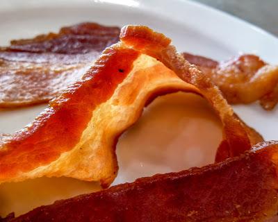 Coffee, bacon, waffle, condiments