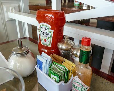 Coffee, bacon, waffle, condiments