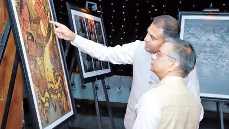 Indian High Commissioner Gopal Baglay is shown the digital recreations of the fresco paintings, at the Indian Pavilion at the Buddha Rashmi National Vesak Festival.  