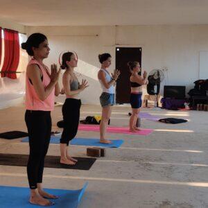 Students-are-performing-Pranamasana-at-Diya-Yoga