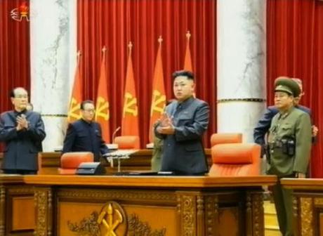Kim Jong Un (2nd R) applauds at the start of a 8 December 2013 expanded KWP Political Bureau meeting (Photo: KCTV screen grab).