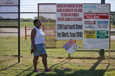 Phyllis Allen in front of a compressor station near her home in Fort Worth. ©2013 Julie Dermansky