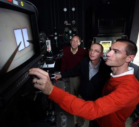 Sandia National Laboratories researchers Mark Allendorf, left, Alec Talin, center, and Francois Leonard measure the conductivity of a metal-organic framework (MOF) device. As described in a paper published in Science magazine, the team developed a technique that increases the electrical conductivity of one MOF by over six orders of magnitude.