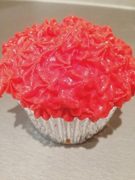 piped star effect red buttercream icing on silver cupcake base for christmas kids ideas
