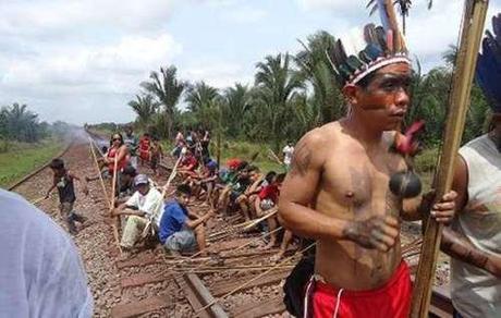 Natives in northern Brazil blockade railway during actions against new legislation, Oct 2, 2012.