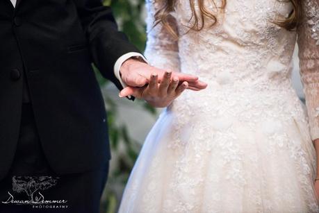 Wedding couple holding hands