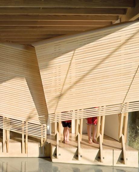 Custom-designed communal living room area with wood slats