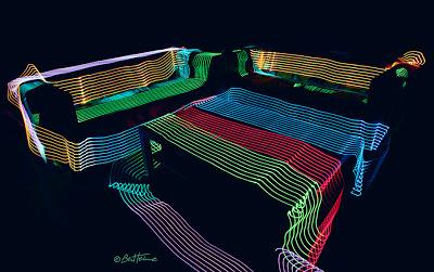 Art by Ben Heine - Sofa and table surrounded by Led Lights - Long Exposure Photo