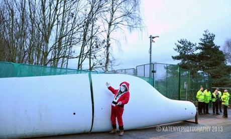 Protester dressed as Santa next to wind turbine placed by activists at Barton Moss drilling site operated by IGas Photograph: /No Dash for Gas