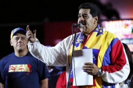 Venezuela's President Maduro talks to supporters during a meeting at Plaza Bolivar in Caracas