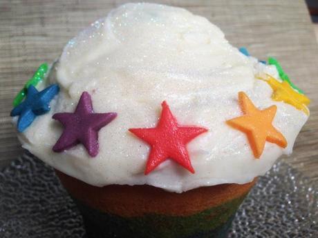 easy all in one rainbow birthday cake giant cupcake with vanilla buttercream and bright coloured fondant stars