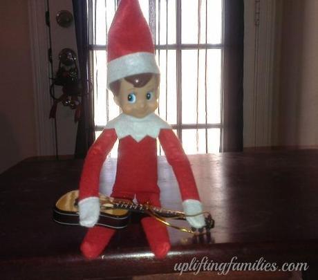 Rascal elf on the Shelf Playing Tap Harmonics on the Guitar