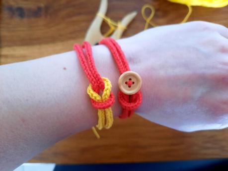 10 easy lucet projects Lucetted bracelets: red and yellow with decorative knot; red with wooden button