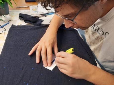 Cutting out a space for the comet in the dark fabric