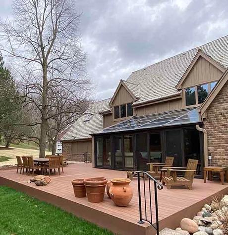 Person sitting in seaside lounge chair