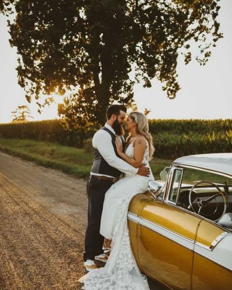 best wedding venues in michigan bride sitting in the car with groom