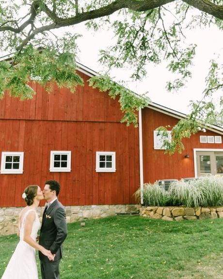 best wedding venues in michigan bride with groom at the farmhouse