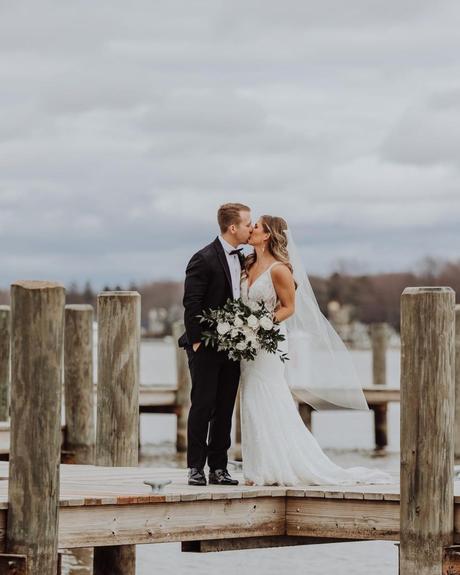 best wedding venues in michigan groom with bride at the pier