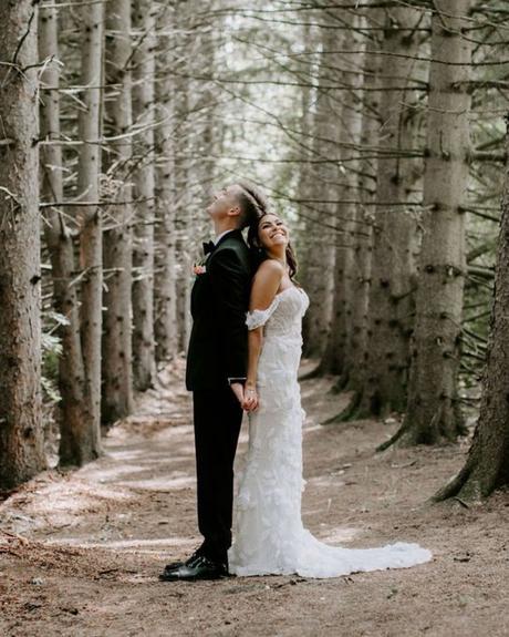 best wedding venues in michigan bride with groom in pine forest