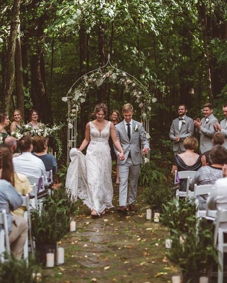 best wedding venues in michigan groom and bride walk-from the archway after the ceremony