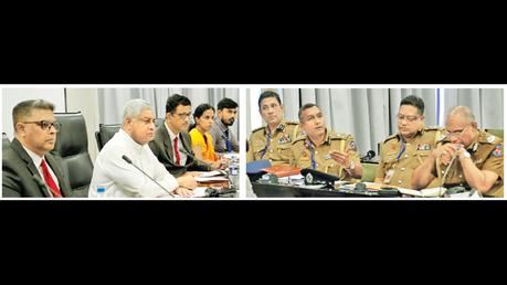 Public Security Minister Tiran Alles with the IGP and Police officers.