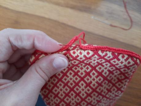 Making a German brick stitch embroidered purse: sewing the lucetted hanging cord
