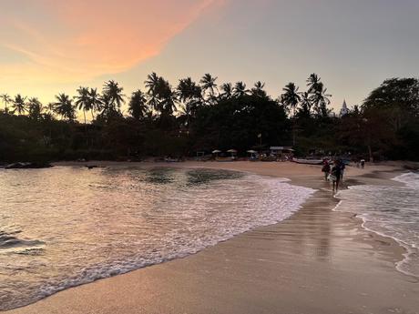 sunset-at-blue-beach-island-nilwella-with-waves-breaking-on-both-sides-of-the-sandbar